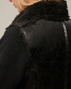 Manteau sans manches en fausse peau lainée Vogue noir